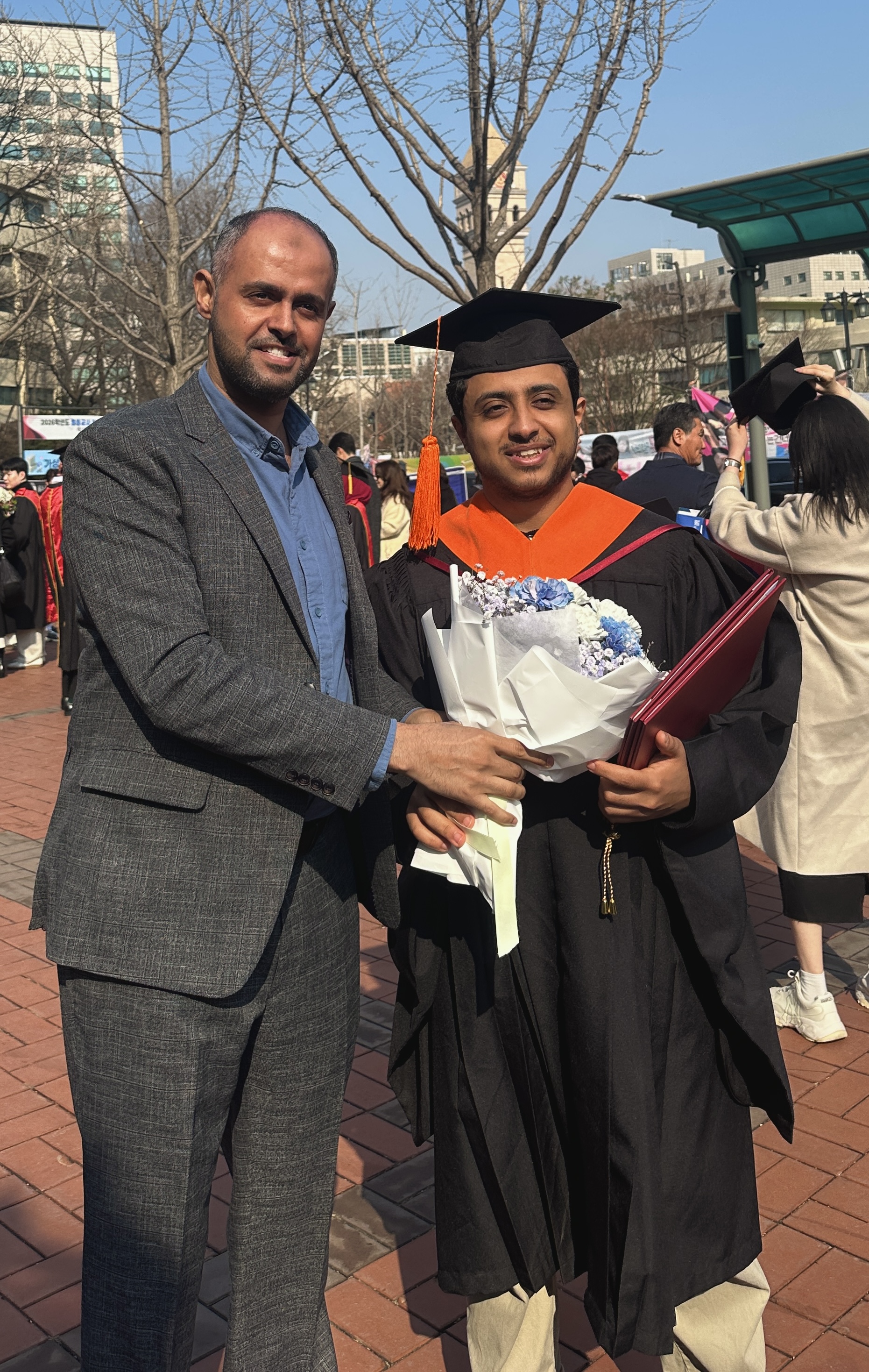 AbdulKhalek celebrating his master's graduation